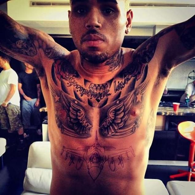 Chris Brown Gets FIGHTER JET Tattoo In SAME SPOT As Rihanna's LATEST